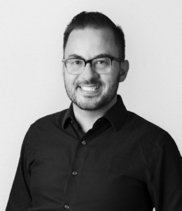 photograph of person looking straight into the camera, smiling