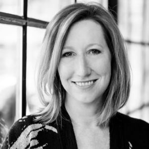 photograph of person looking straight into the camera, smiling
