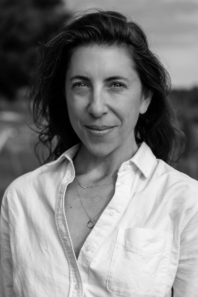 black and white photograph of a person looking straight into the camera